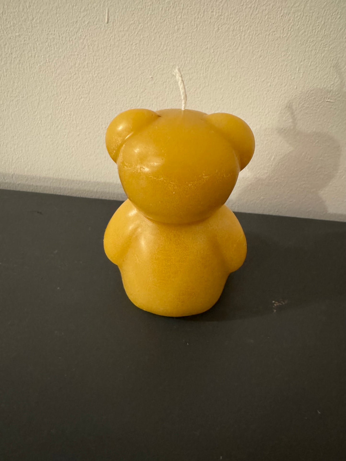 The back of a beeswax bear, perfect for a new parent