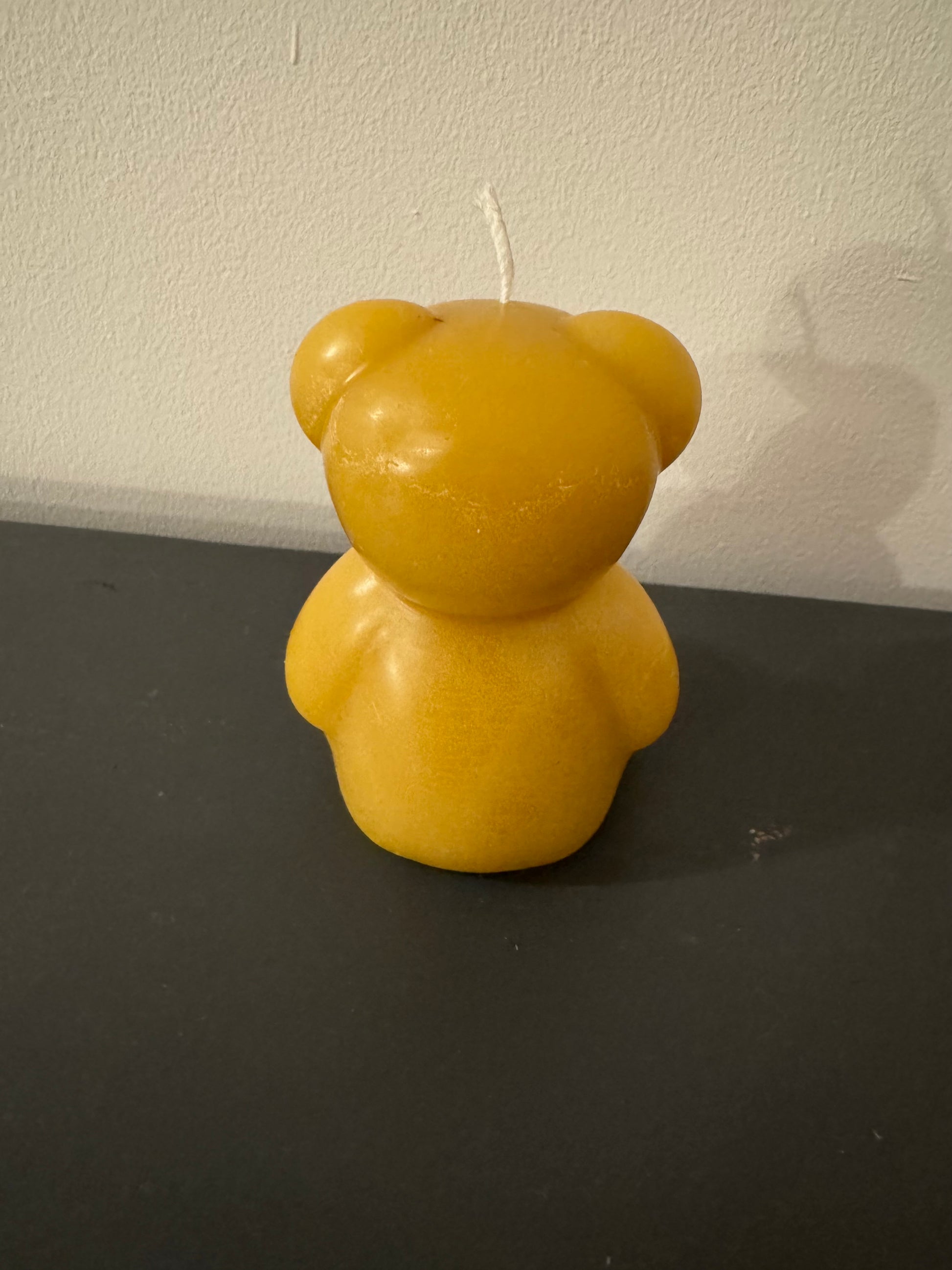 The back of a beeswax bear, perfect for a new parent